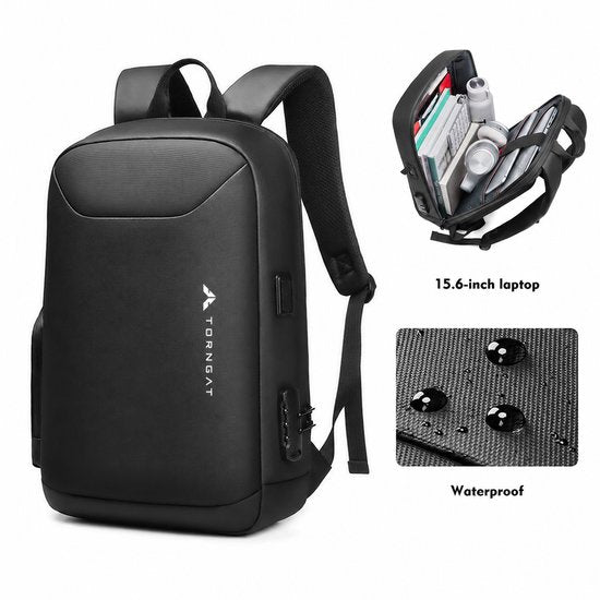 Geopende Torngat rugzak met laptop en accessoires